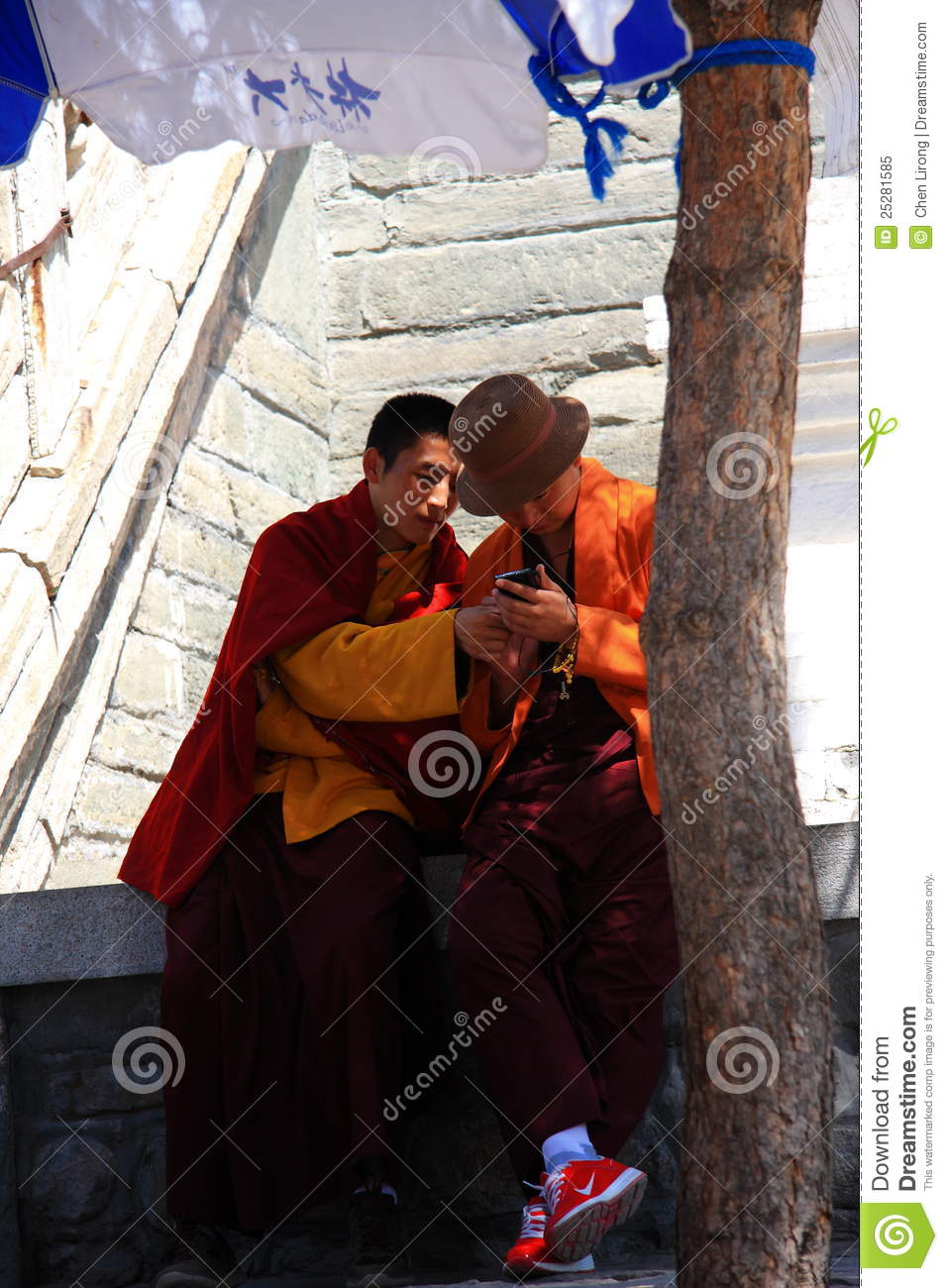 Chinese Monks Are Playing Mobile Phone At Temple
