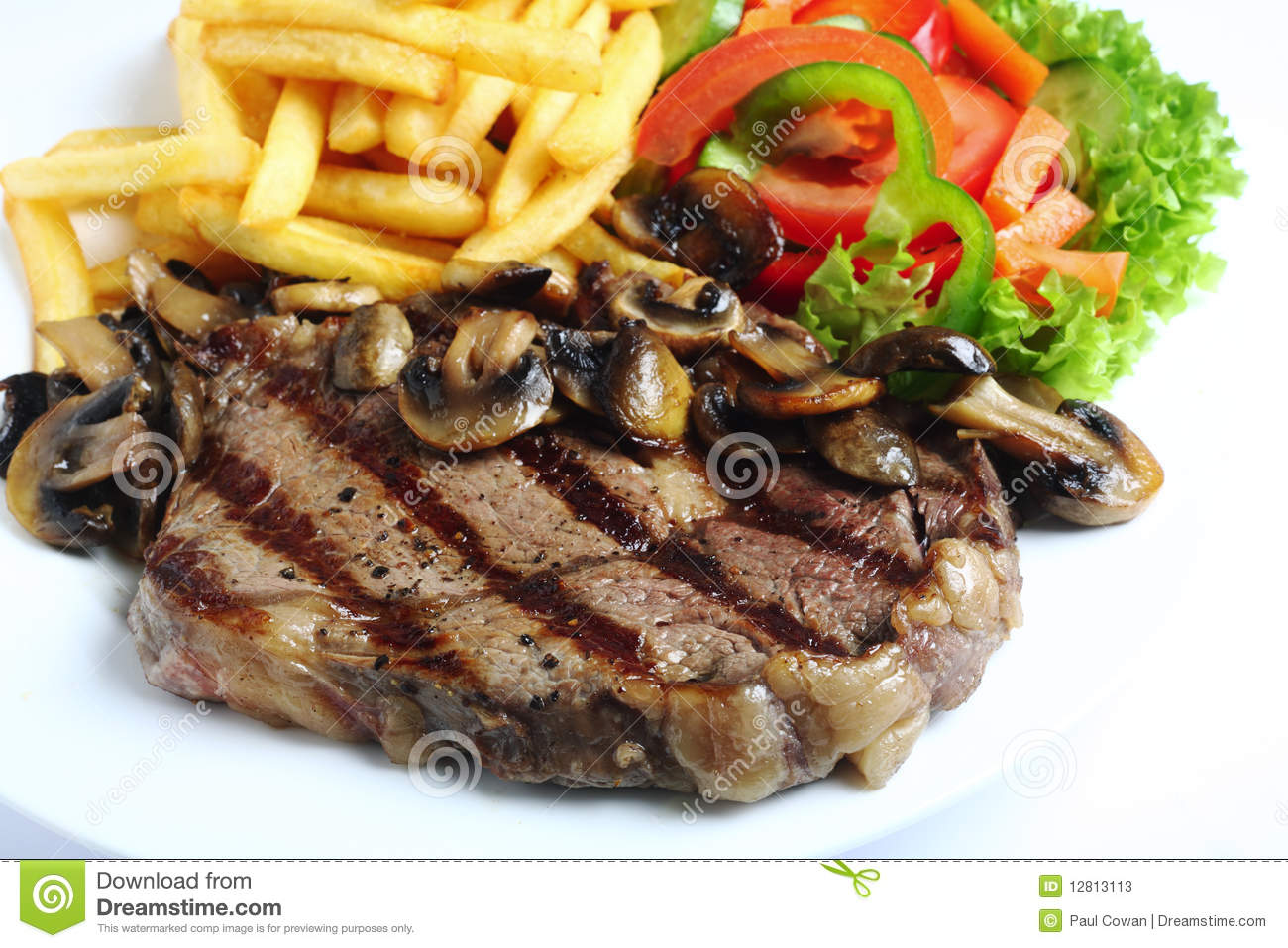 Grilled Ribeye Steak Served With Mushrooms Chips  French Fries  And
