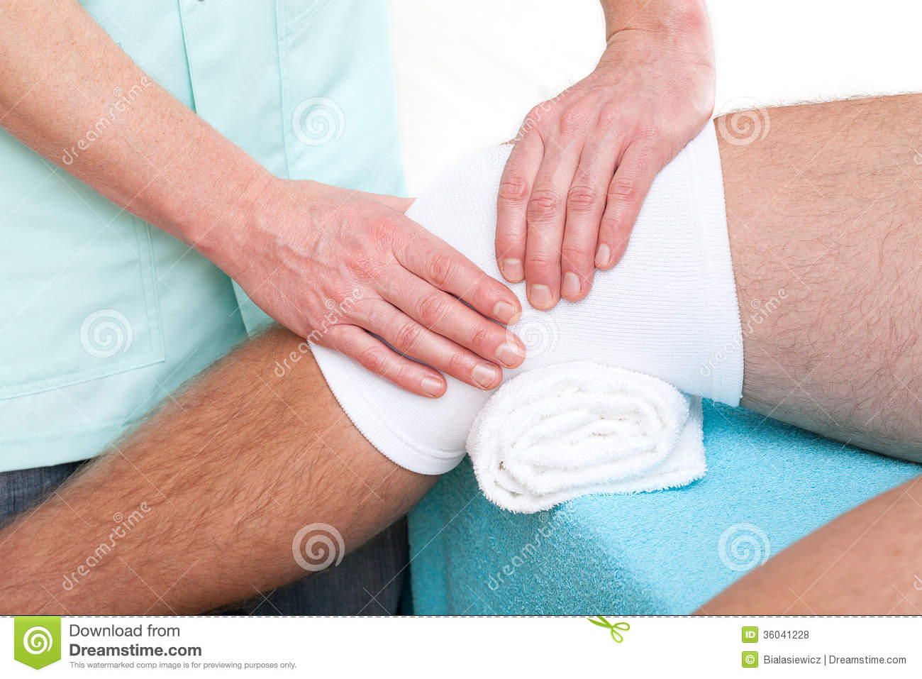 Physiotherapist Making A Massage Of Injured Patient S Knee Joint