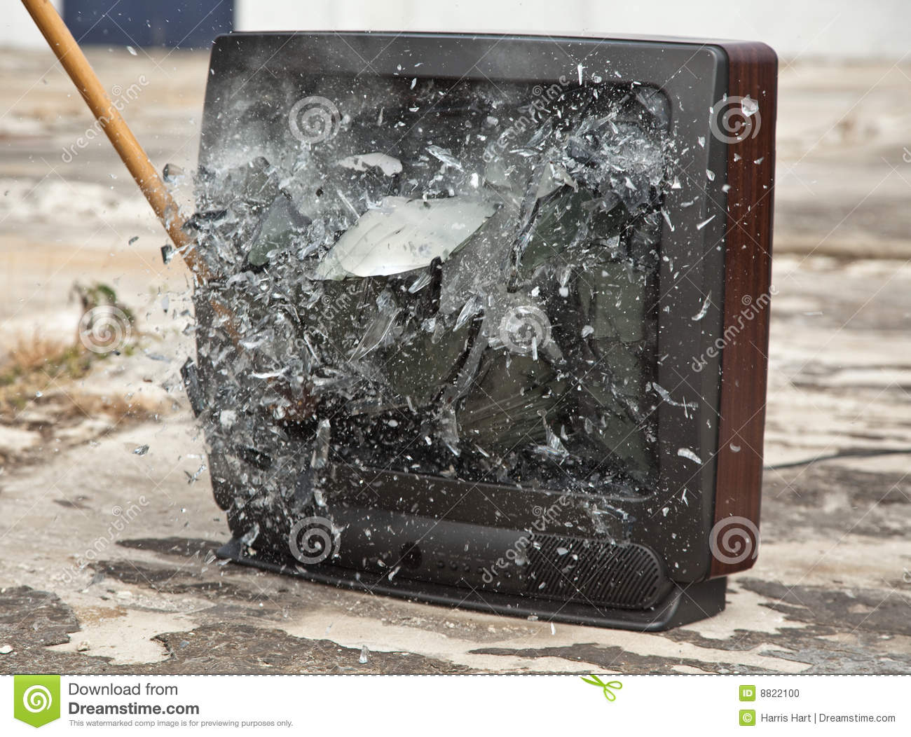An Old Tube Television Exploding From A Sledge Hammer Blow 