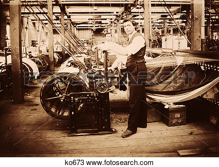 Stock Photo Of Man In Old Fashioned Textile Mill With Huge Rollers