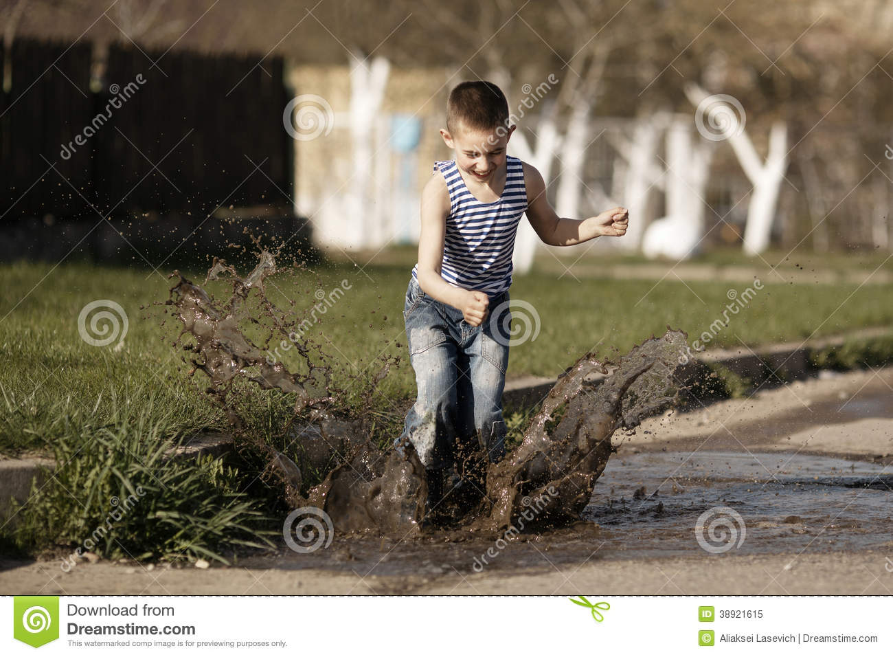 Little Boy Jumping In Puddle Stock Photo   Image  38921615