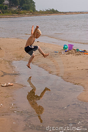 More Similar Stock Images Of   Boy Jumping Over Puddle  