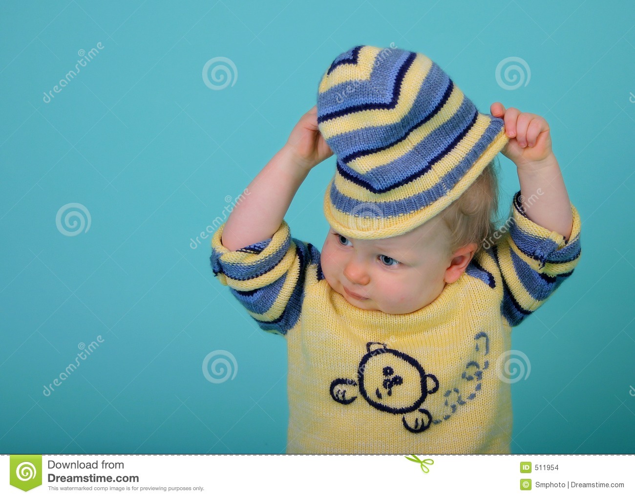 Baby Taking Off His Hat
