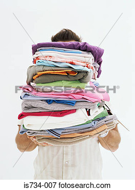 Picture   Man With Pile Of Clothes  Fotosearch   Search Stock