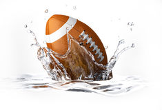 American Football Falling Into Clear Water Forming A Crow Royalty
