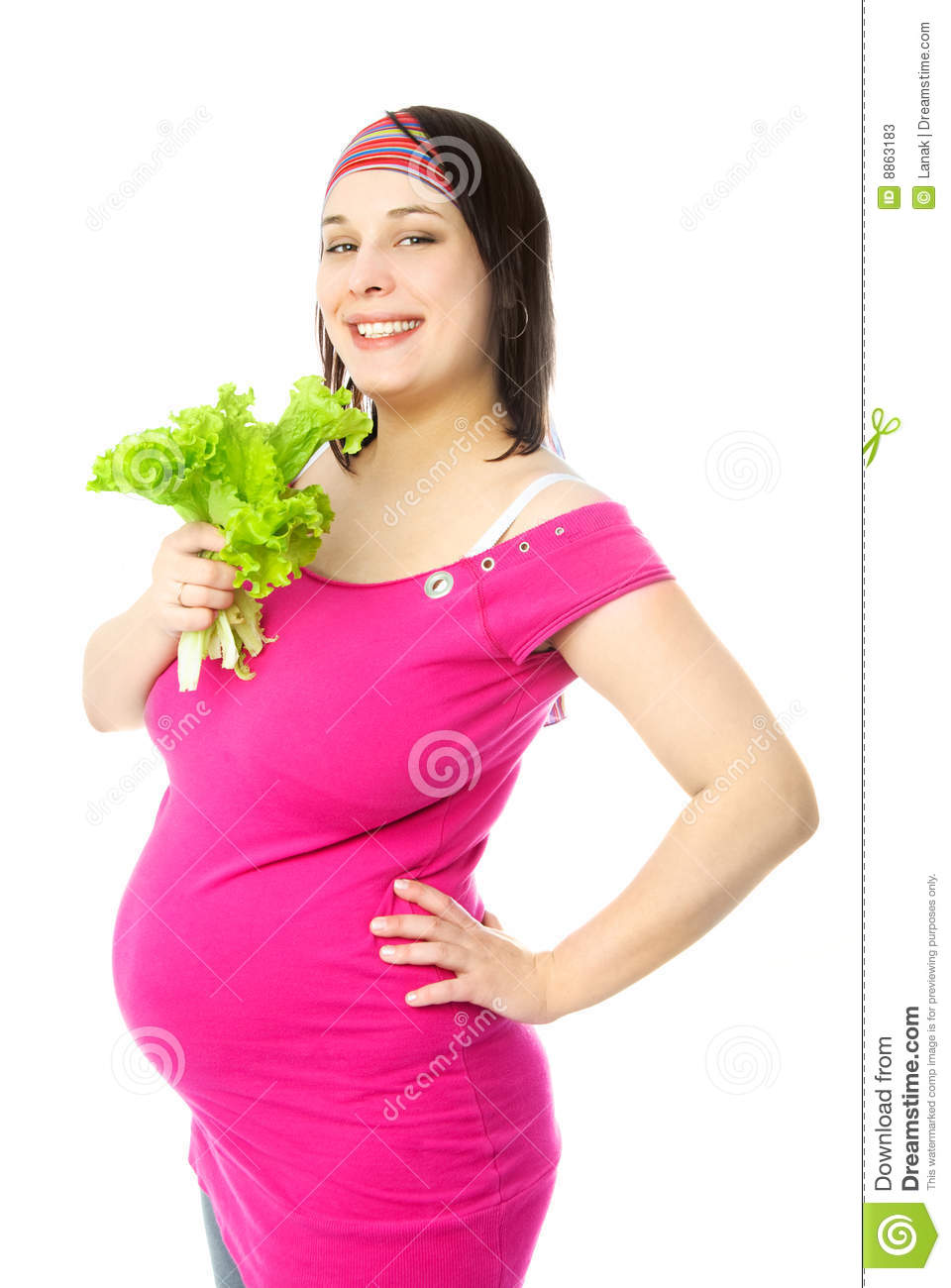 Portrait Of A Happy Young Pregnant Woman Eating Green Salad