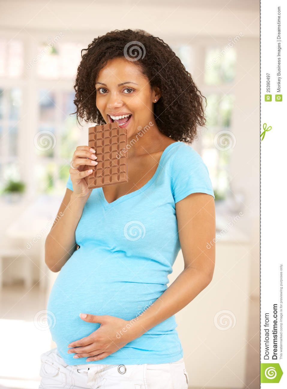 Pregnant Woman Eating Chocolate Royalty Free Stock Photography   Image
