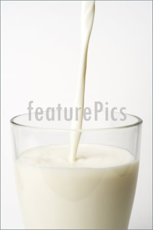 Picture Of Pouring Fresh Glass Of Milk Isolated  Image To Download At