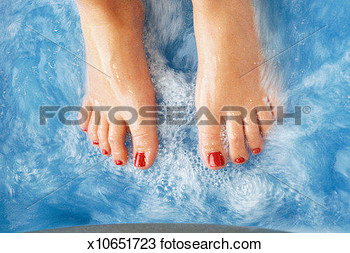 Woman S Feet Resting On Surface Of Water Toenails Painted Red View    