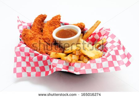 Breaded Chicken Strips With French Fries And Dipping Sauce In A Diner
