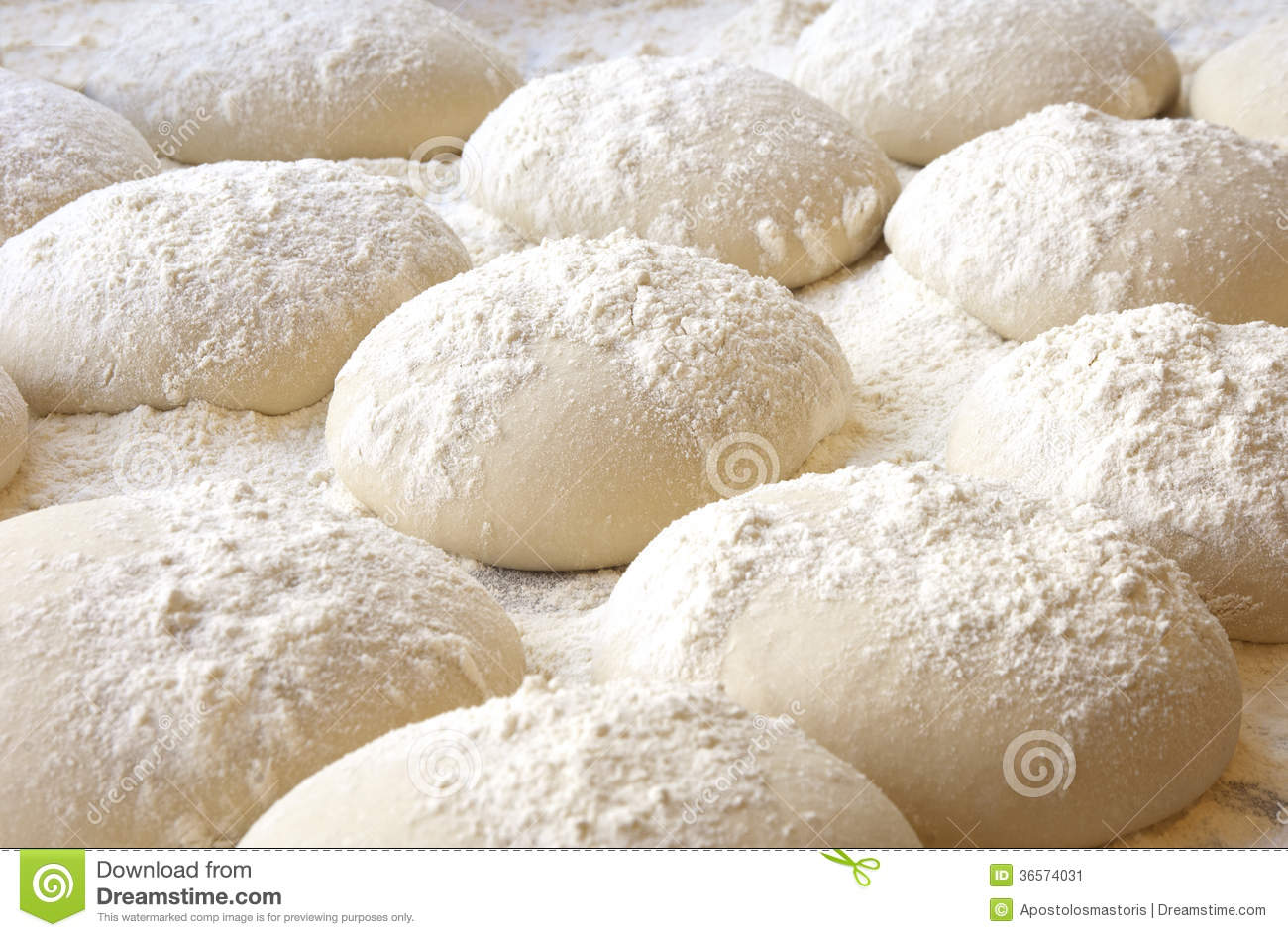 Balls Of Dough Covered With Wheat Flour Ready For Baking