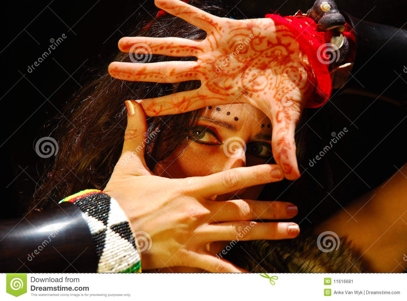 Dancer Woman Looking Through Her Hands With A Mysterious Expression