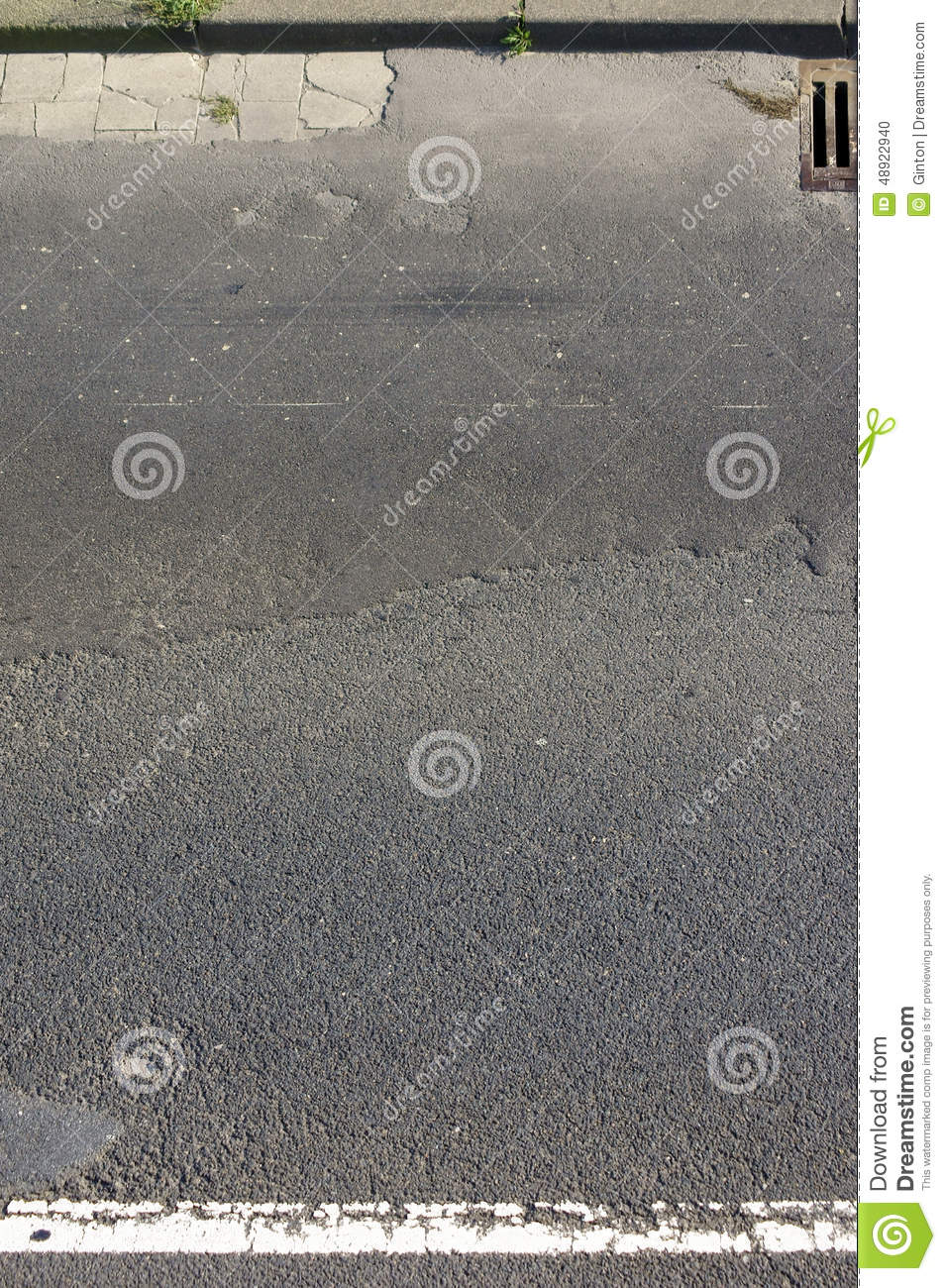 The Top View Of The Crumbling Asphalt Of A Highway With A Gully 
