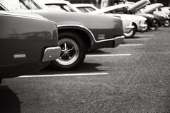 Photograph Of Classic Vehicles Parked In A Row