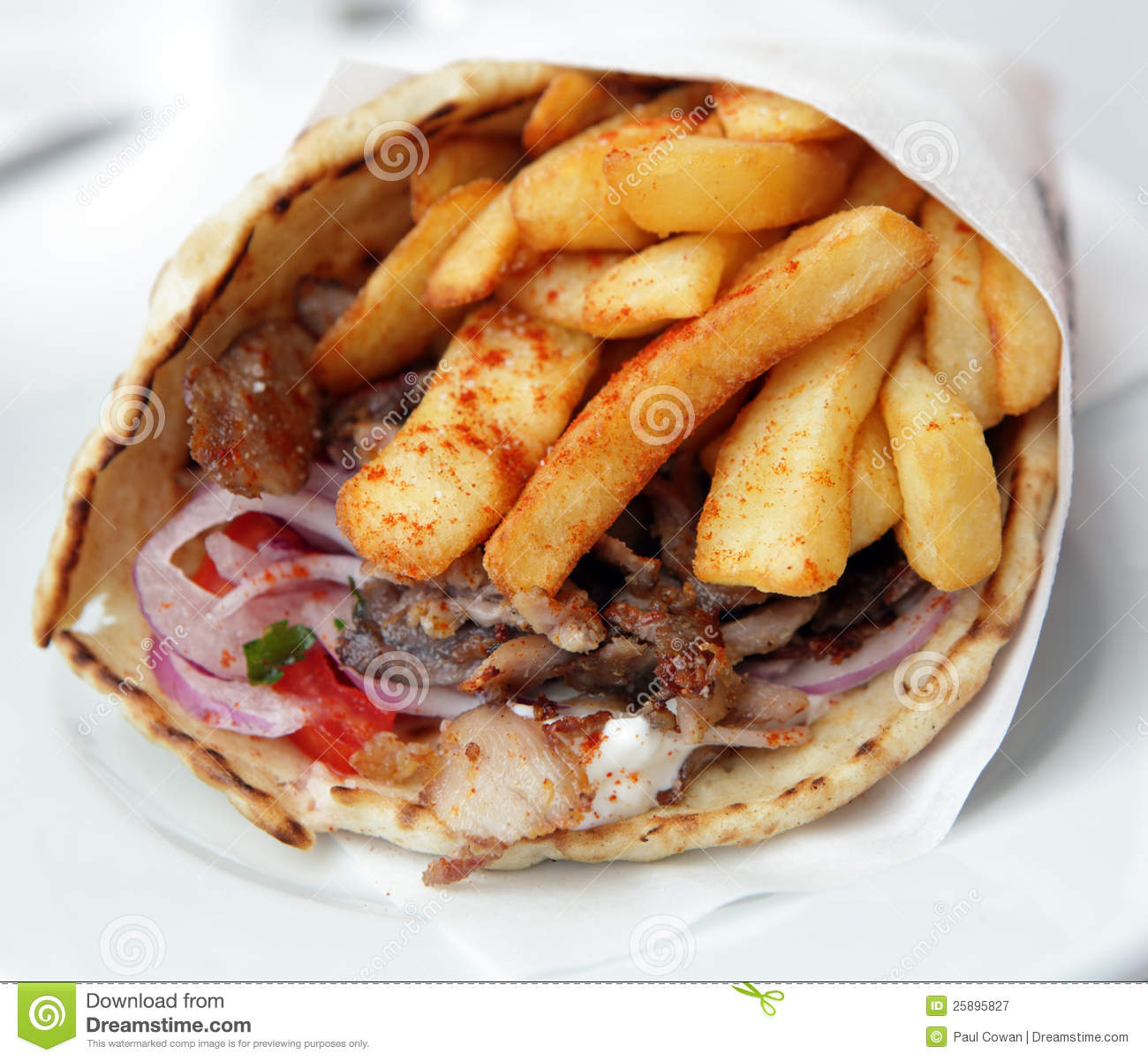 View Of A Pork Souvlaki Wrap Or Pitta Gyros Incorporating Fries    