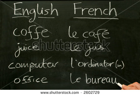 Teacher Writing French Lesson Words On A Blackboard  Stock Photo    