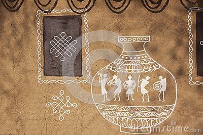 Ethnic Adobe Mud Wall Painted In Orange Color And Decorated With Old