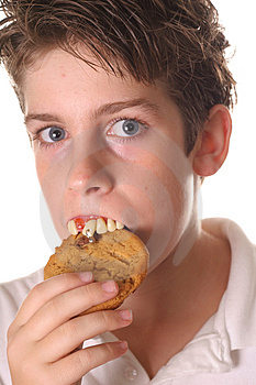 Free Stock Photography  Young Boy With Rotten Teeth Eating A Cookie