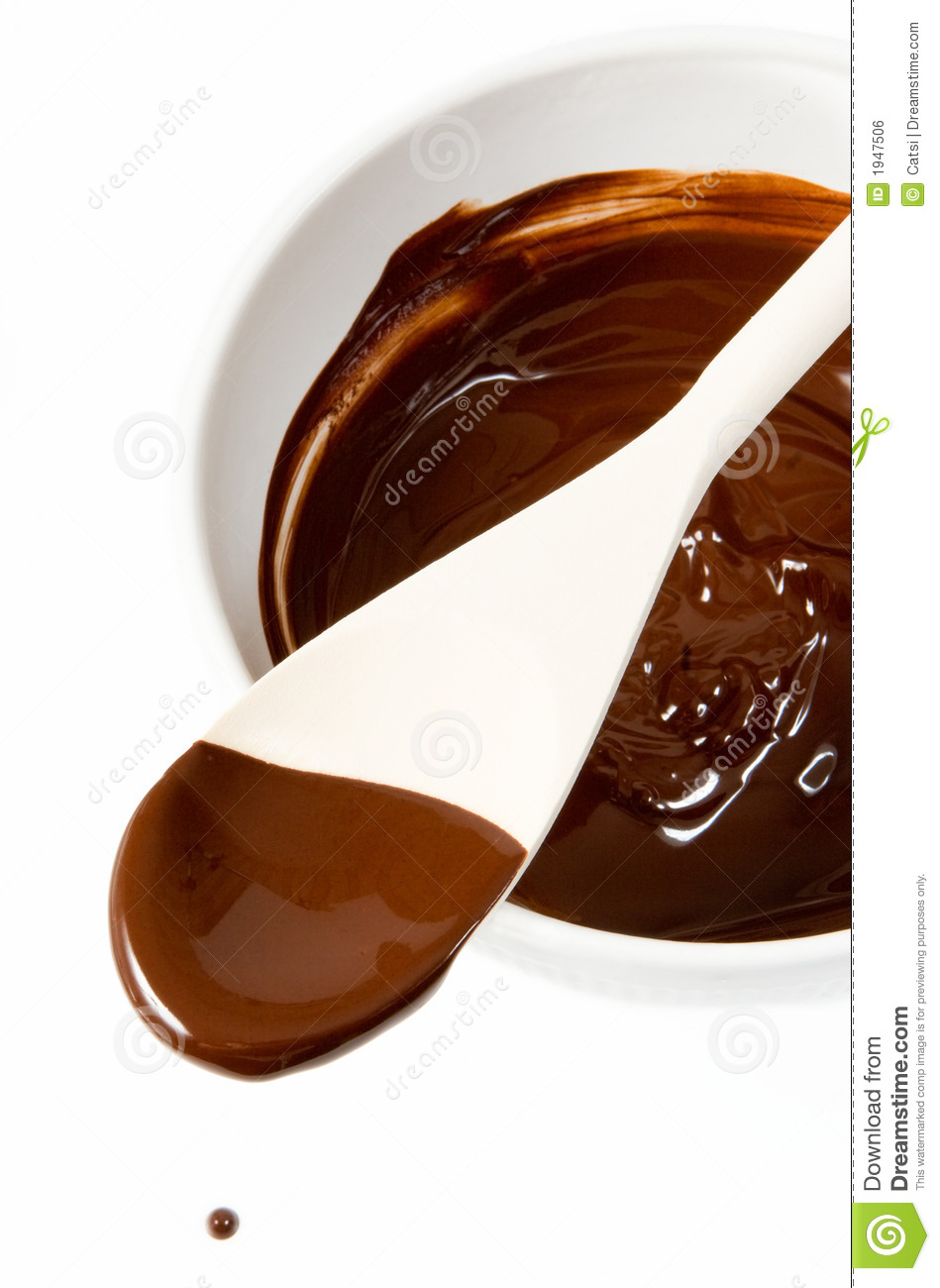 Melted Dark Chocolate Dripping From The Spoon Royalty Free Stock Image