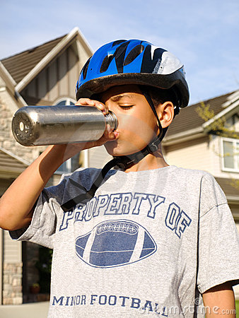 Year Old African American Boy In Bike Helmet Drinking From Reusable