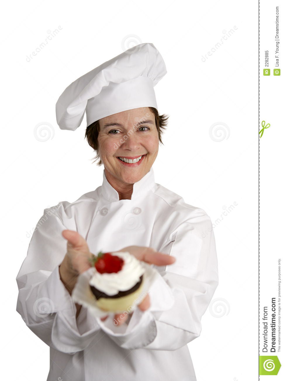 Friendly Happy Looking Pastry Chef Holding A Dessert She Just Made    
