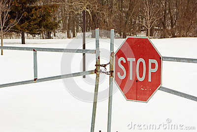 Locked Gate With A Stop Sign At A Park That Is Closed For The Winter