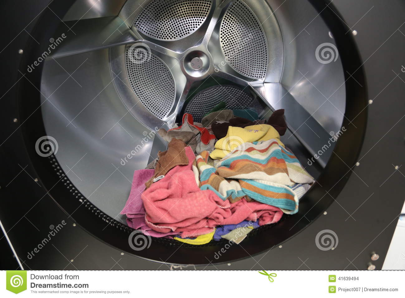 Towels Inside The Drum Of A Huge Industrial Dryer Machine At A Laundry