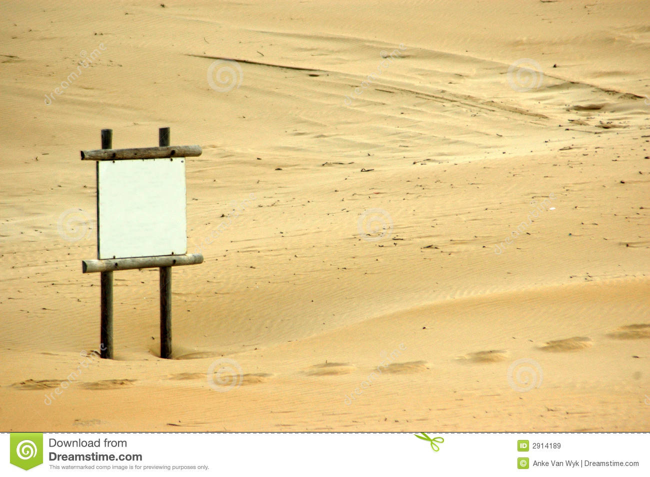 White Blank Sign Standing On Wooden Poles In The Sand On The Beach    