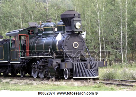 Antique Train On Track With Smoke Out Of It S Stack