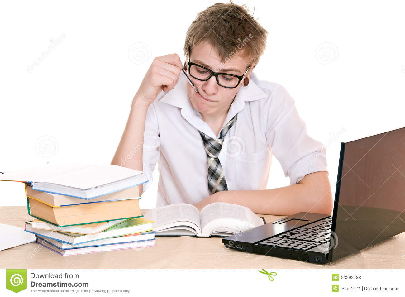 Frustrated Student Sits Behind A Desk Isolated On White Background