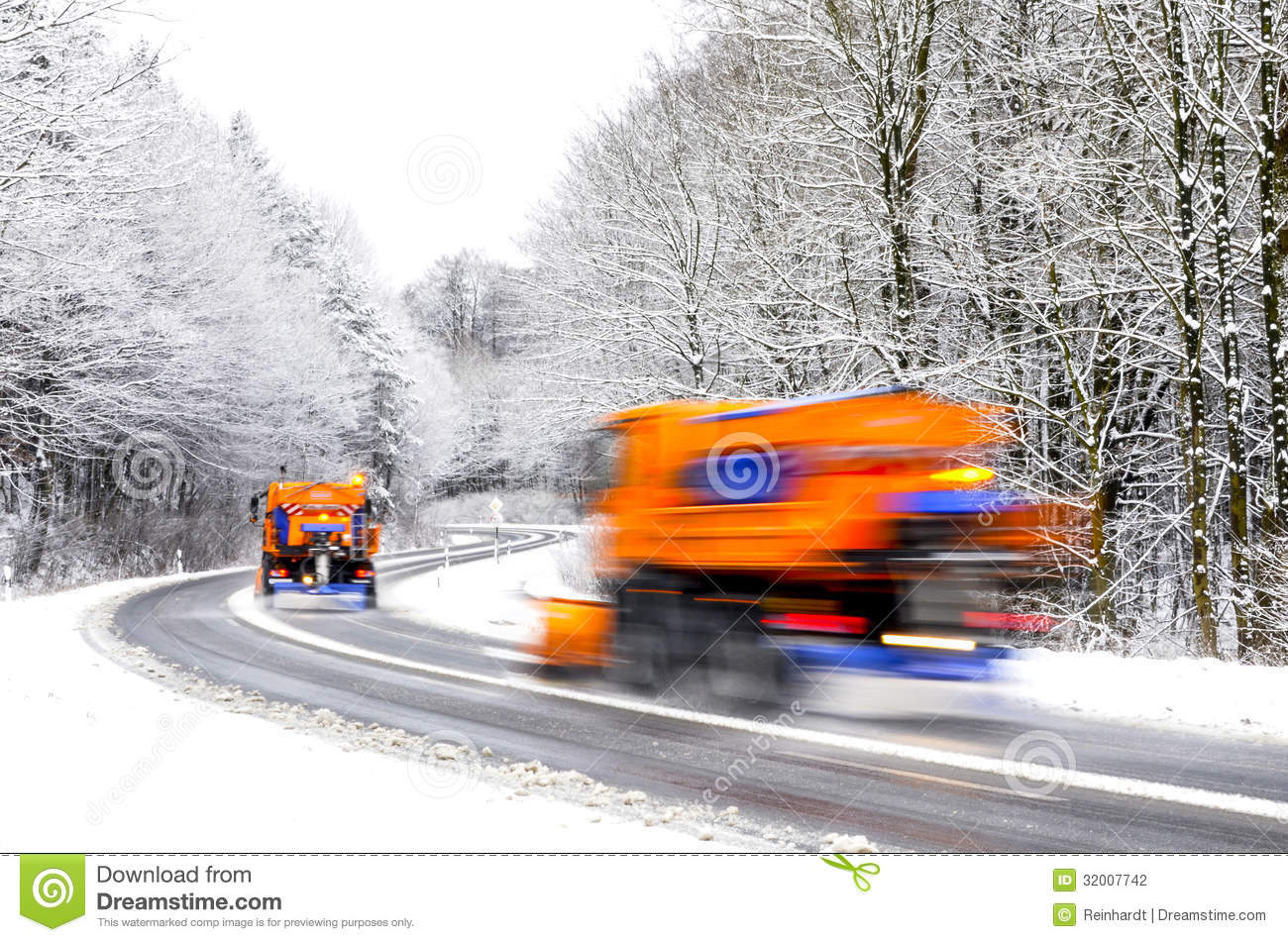 Two Snow Plows Working On Winter Road Vehicles Blurred