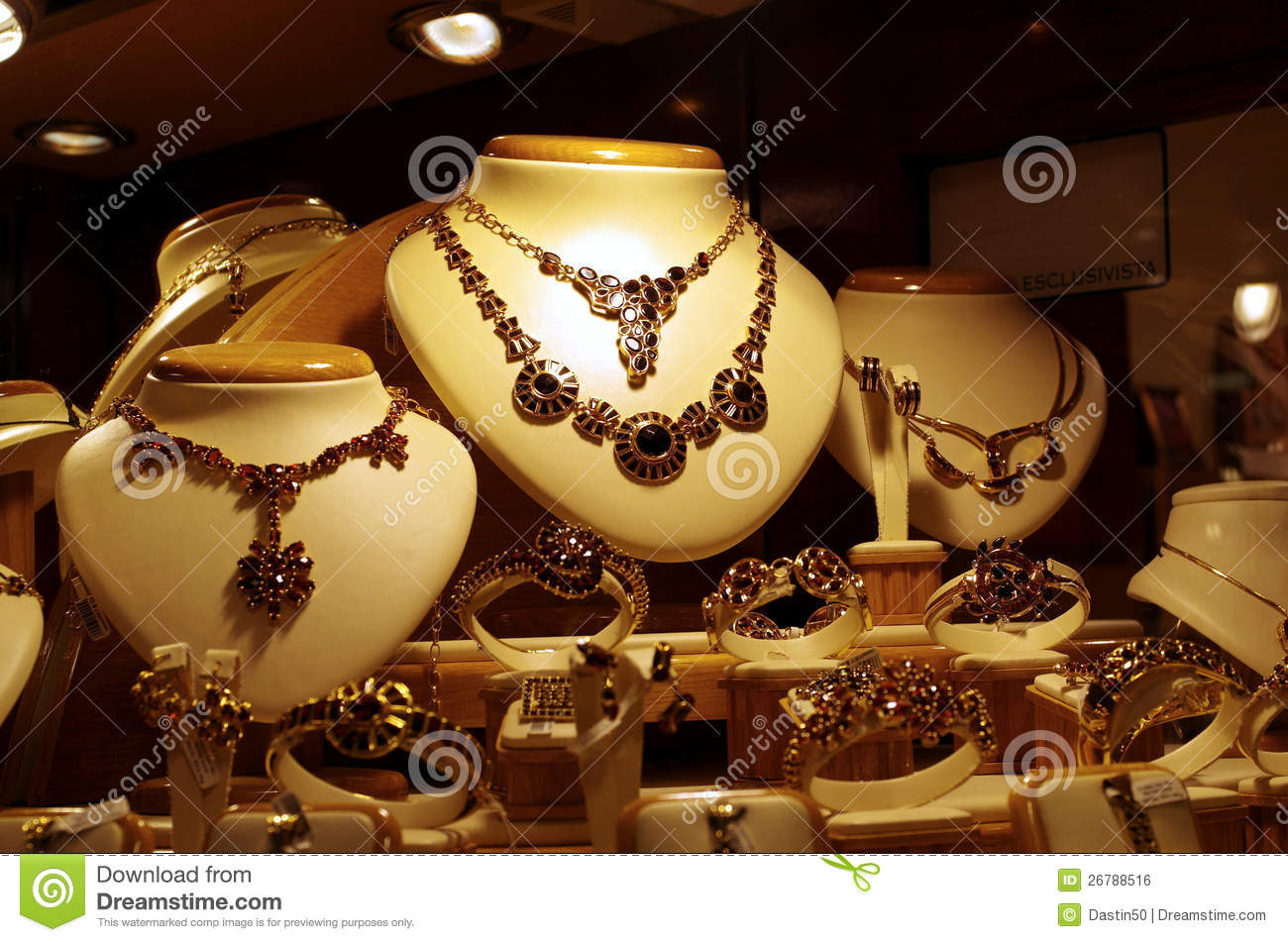 Gold Necklaces And Bracelets Displayed In A Jewelry Shop Window