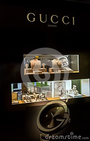     Window Of A Gucci Luxury Shop At Night With Watches And Jewelry
