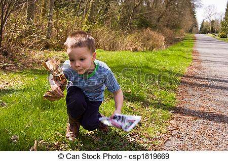 Stock Photographs Of Young Boy Picking Up Trash On Roadside   A Young