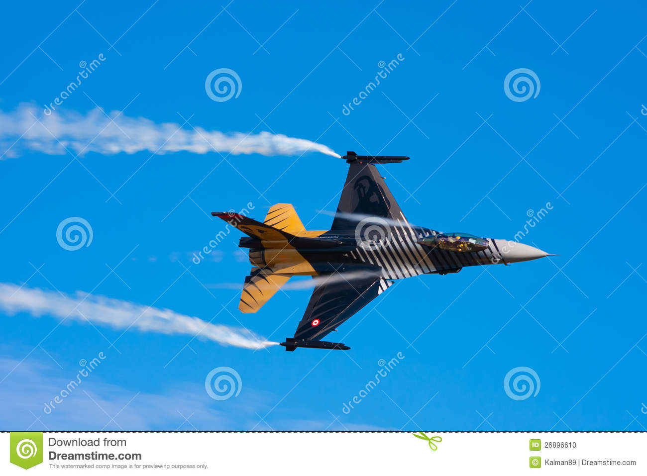 16 Military Jet Fighter In Flight At High Speed Creating Vapor    