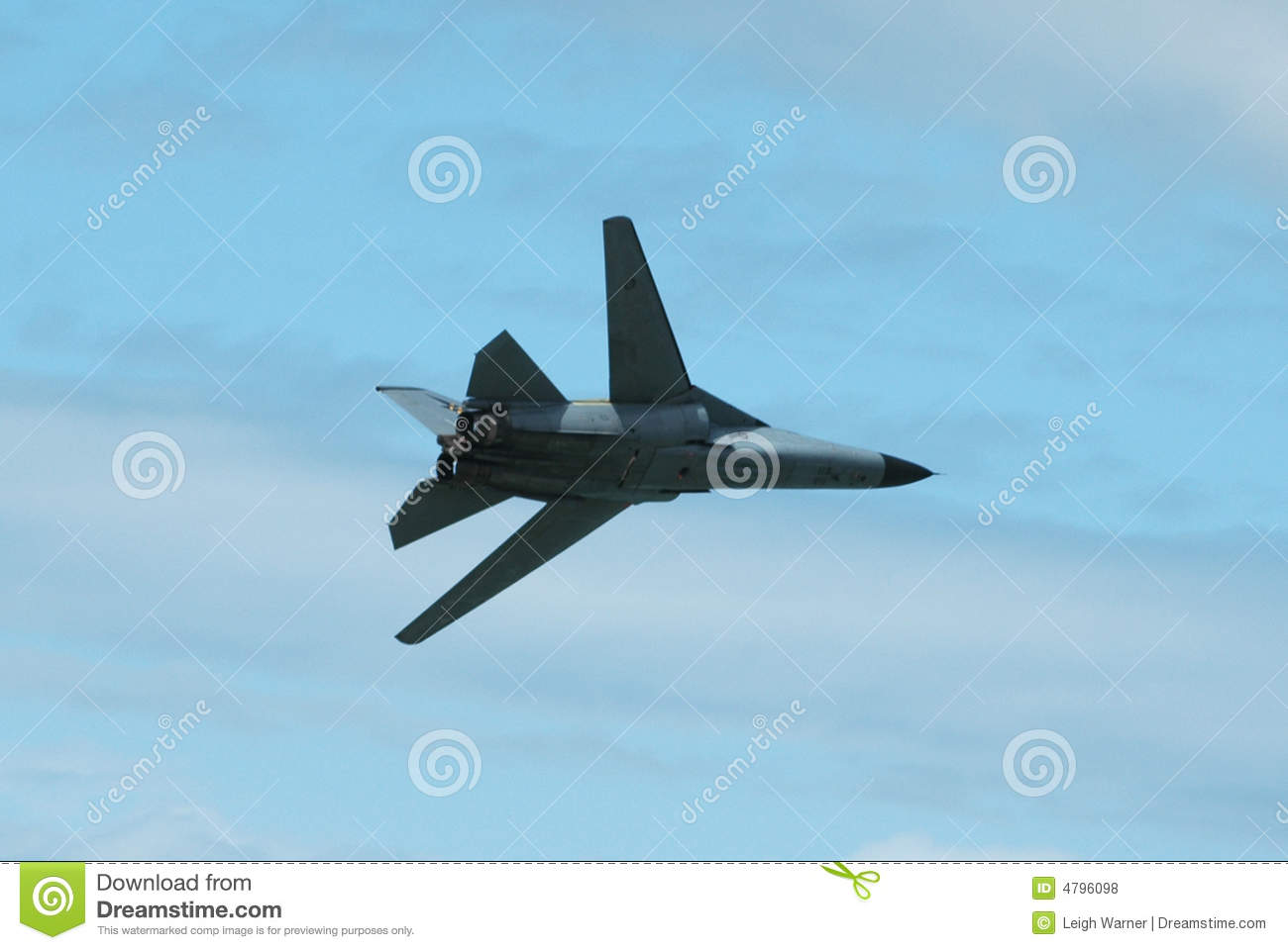 Military Jet Aircraft In Flight With Blue Sky Background And Copy    