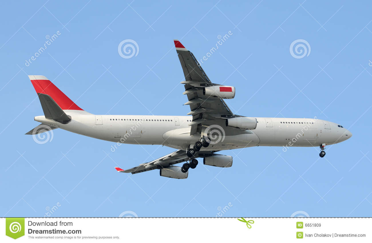 Modern Passenger Jet In Flight Against Blue Sky