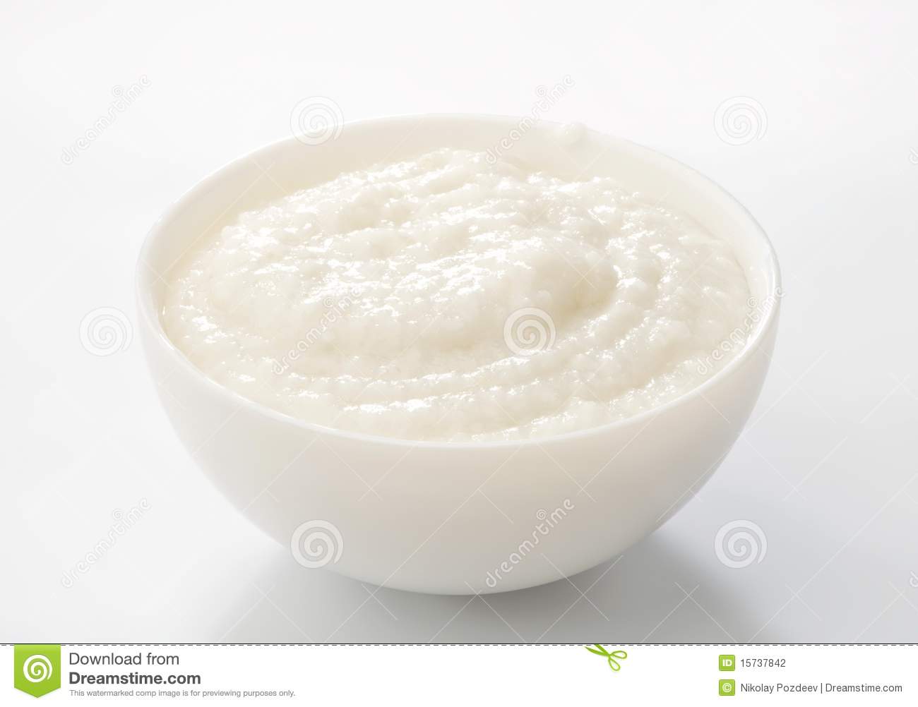 Rice Porridge In Porcelain Bowl Close Up On White