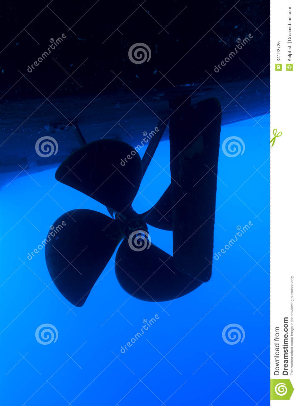 Boat Propeller And Rudder On A Large Vessel In Blue Water 