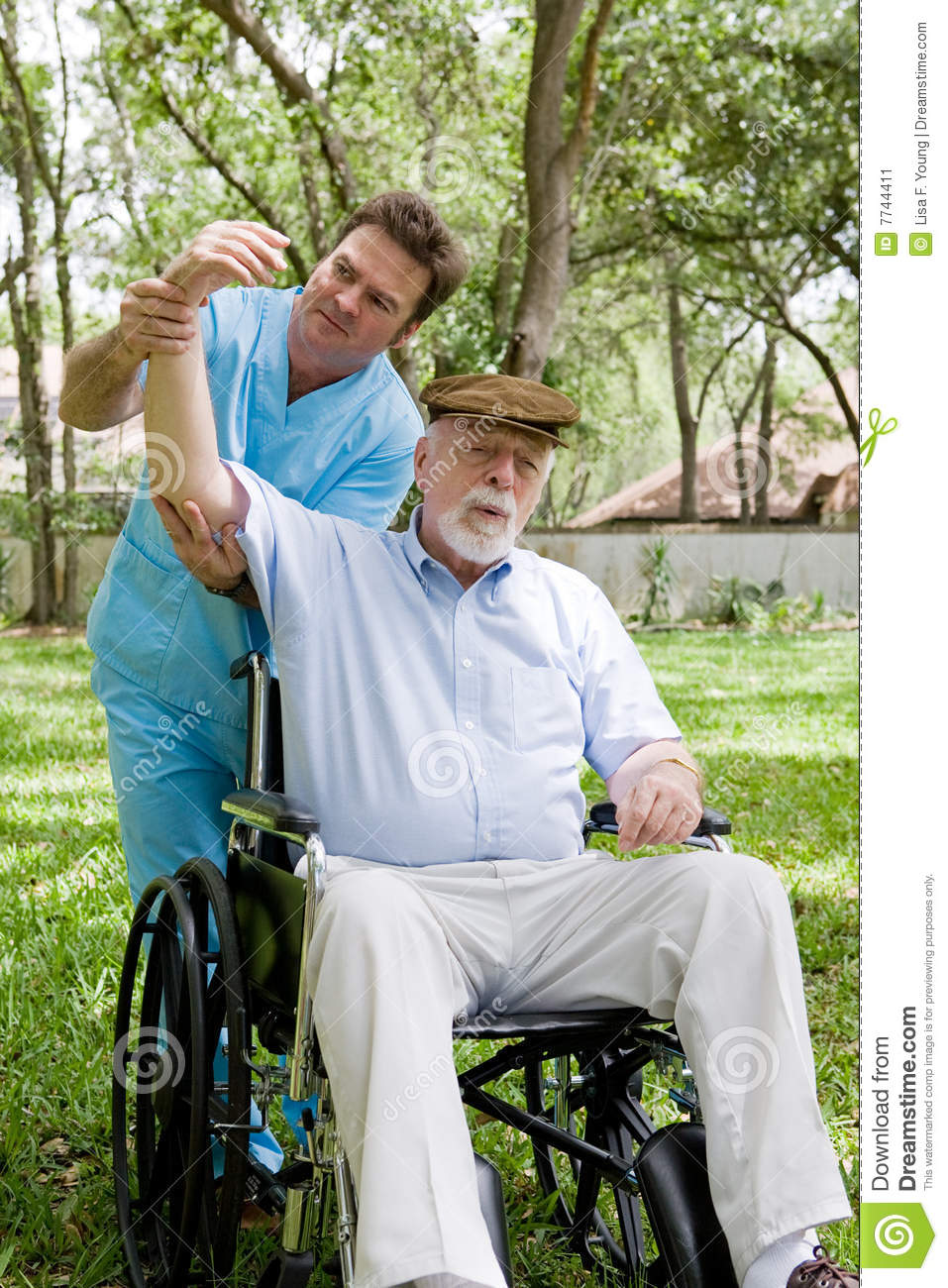     Working With Disabled Senior Man Outdoors In A Natural Setting