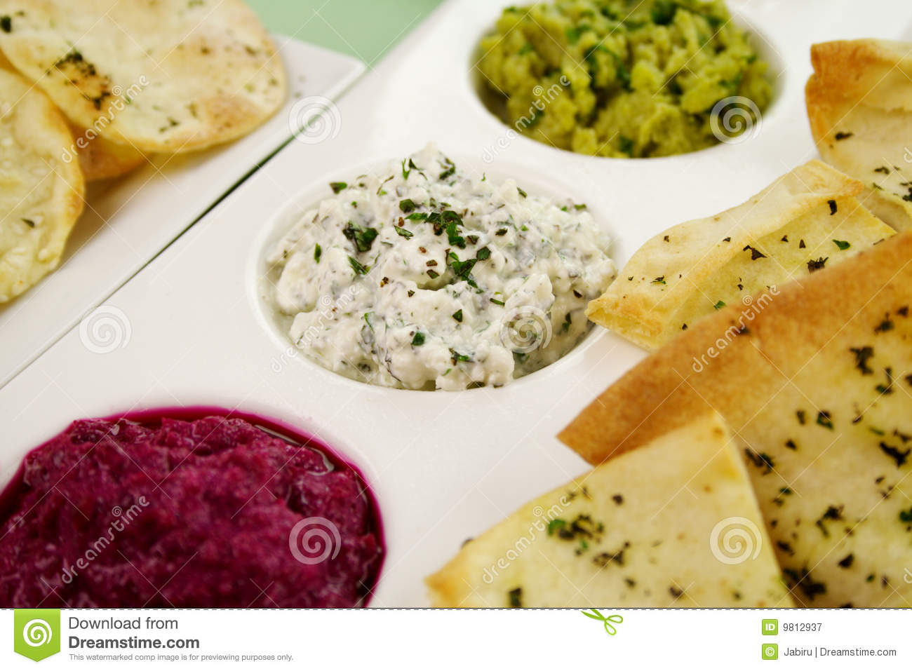 Assorted Dips Of Cottage Cheese And Herbs Pea And Basil With Pita