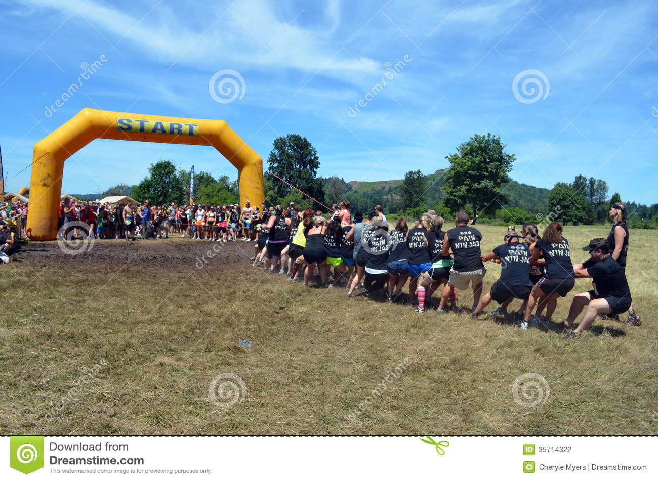 Runners In The Dirty Dash 5k Mud Run At The Starting Line Tug O War