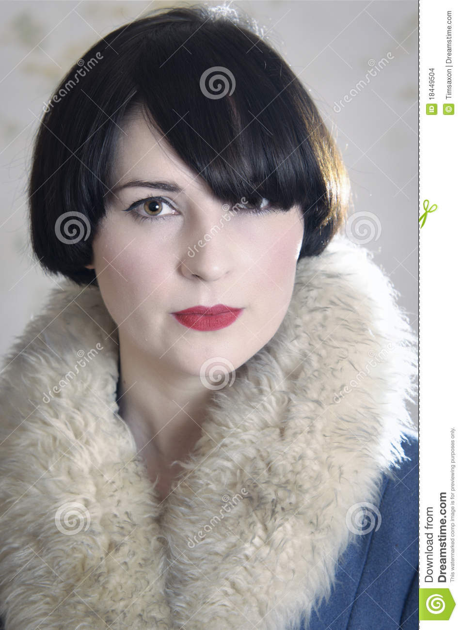 Dark Haired Young Woman Wearing A Coat With A Fake Fur Collar