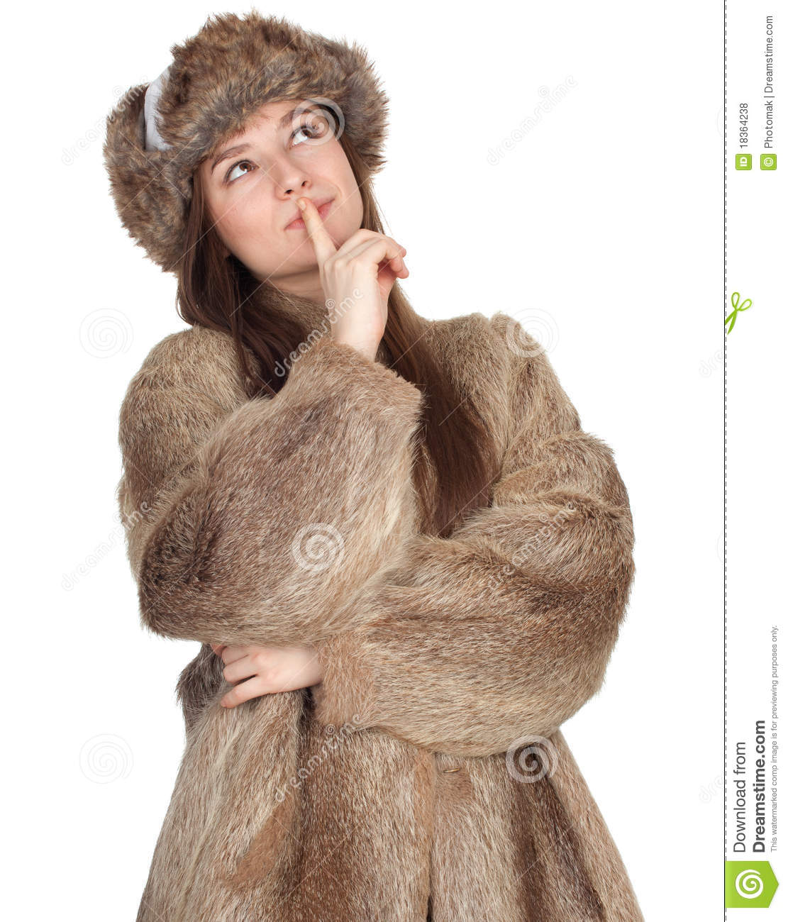 Thoughtful Beautiful Young Woman In Fur Coat And Hat