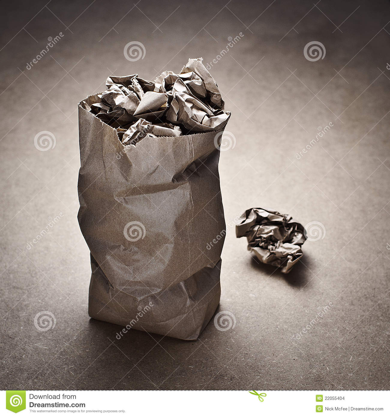 Brown Paper Bag Containing Wadded Up Paper Bags Sitting On Brown