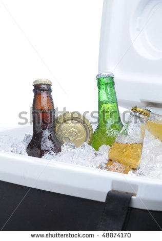 Close Up Of An Assortment Of Beer Bottles And Cans In Cooler With Ice