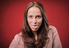 Woman Stucking Out Her Tongue Royalty Free Stock Photo