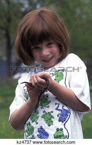 Picture Of 4 Year Old Girl Holding Juvenile Ball Python Python Regius    