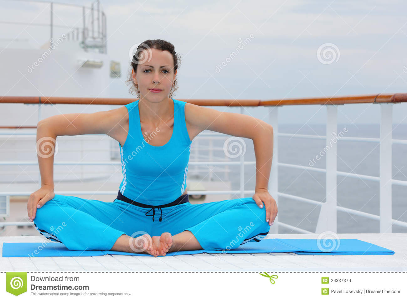 Beautiful Barefoot Woman Wearing In Sports Suit Sits On Cruise Liner